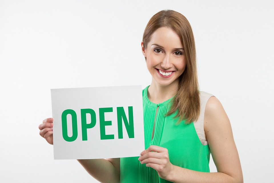 Beautiful woman holding a signboard